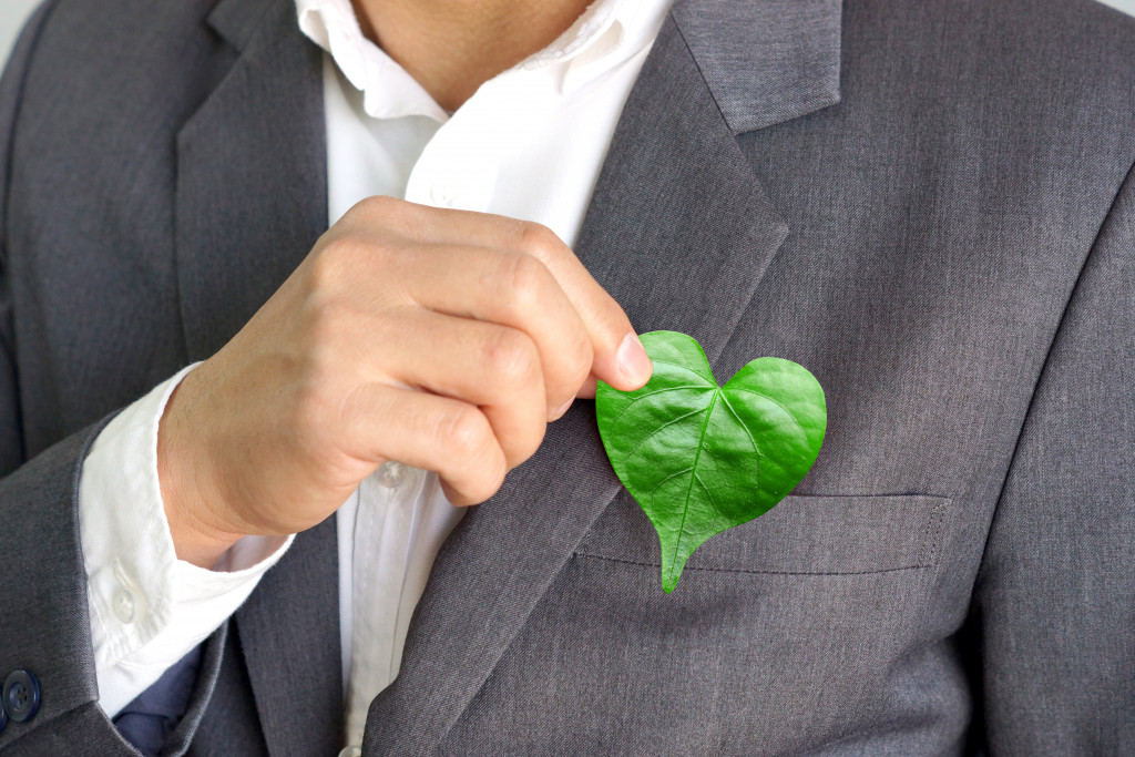 Businessman holding a leaf