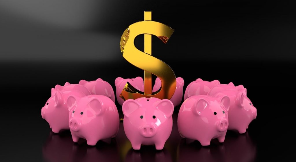 large dollar sign encircled by multiple pink piggy banks 