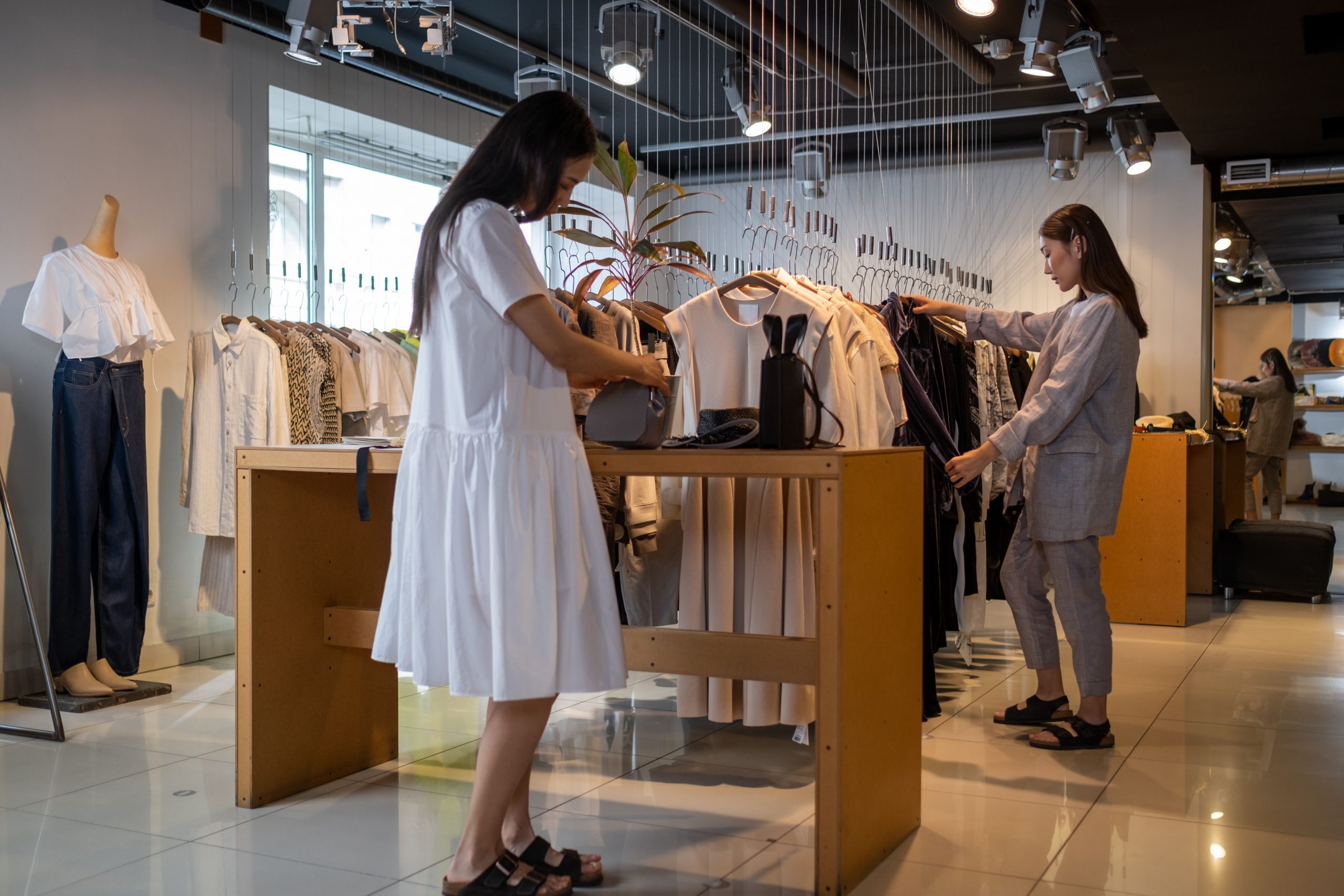 two women shopping in a chic boutique